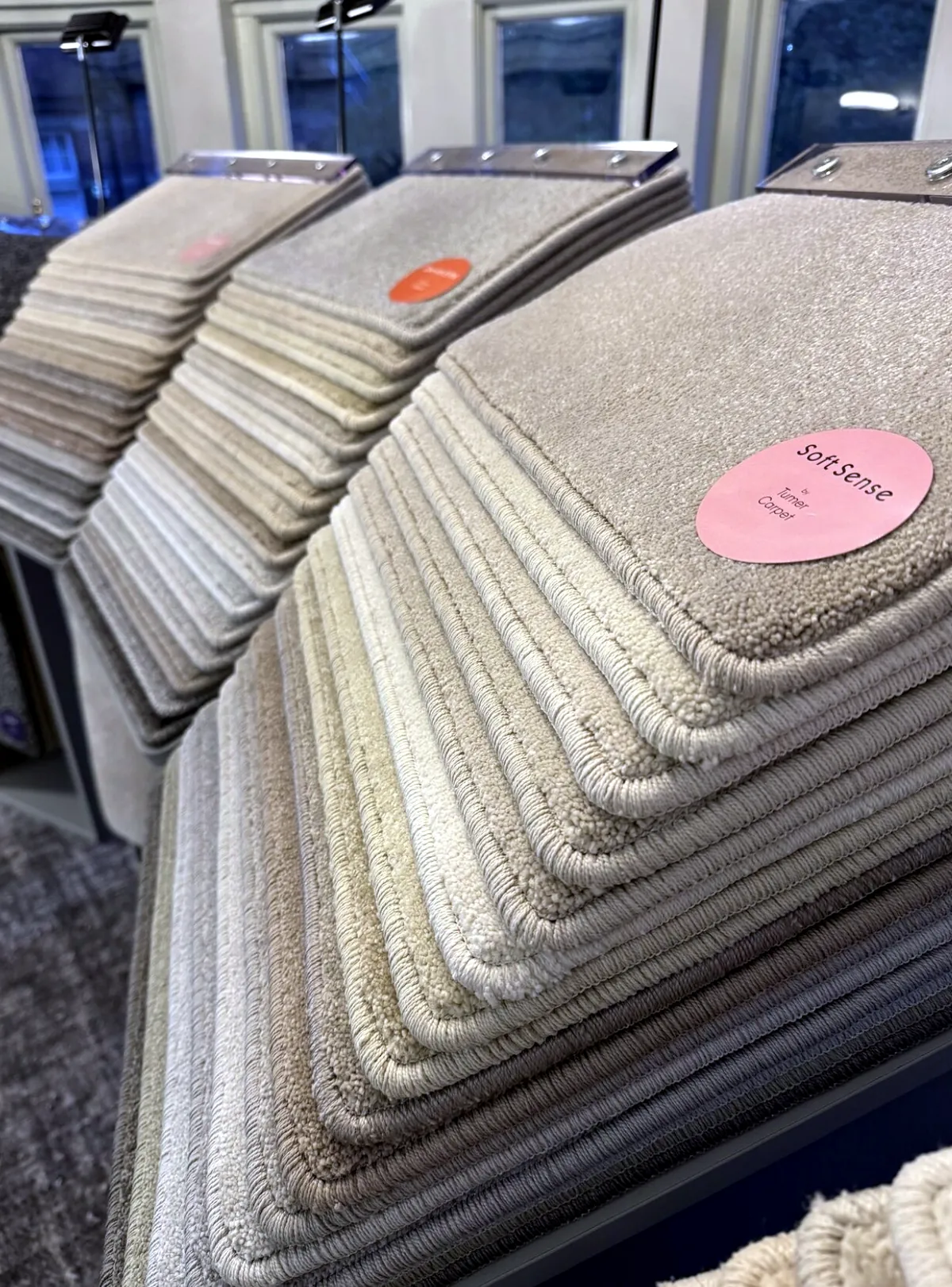 Stacked cut pile samples in neutral tones
