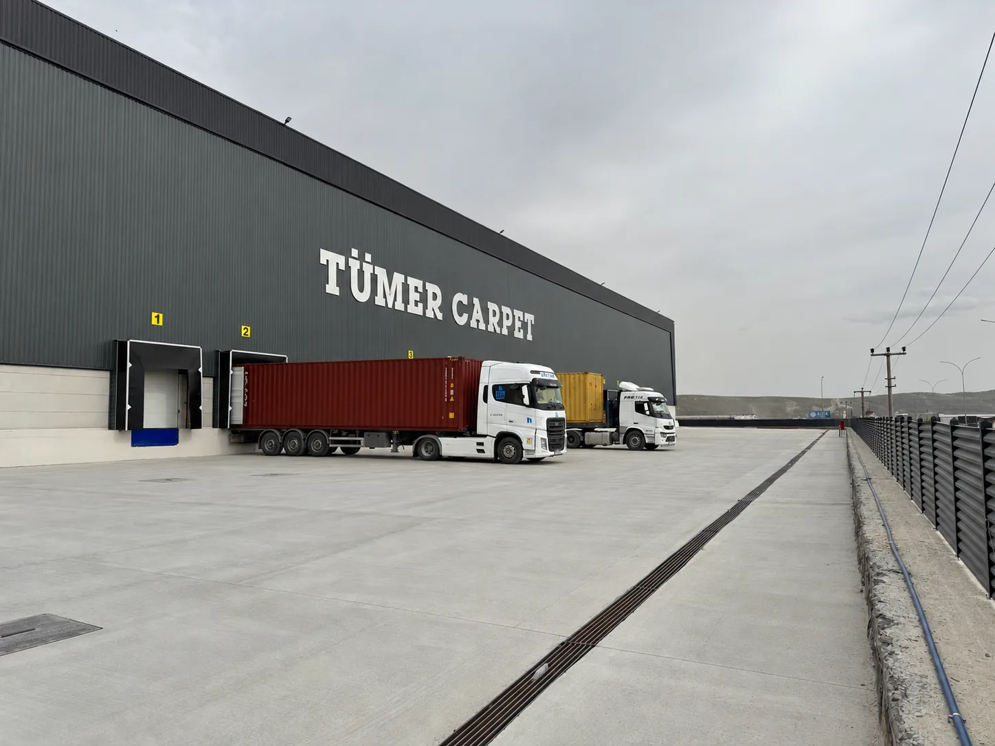 Container trucks at the Tumer Carpet loading docks