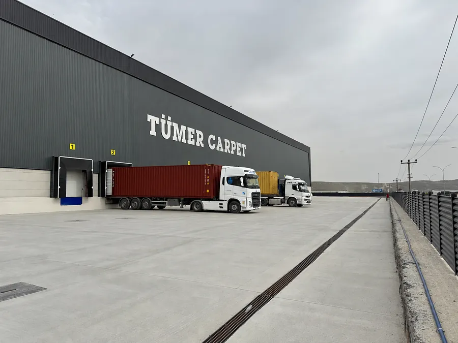 Container trucks at the Tumer Carpet loading docks