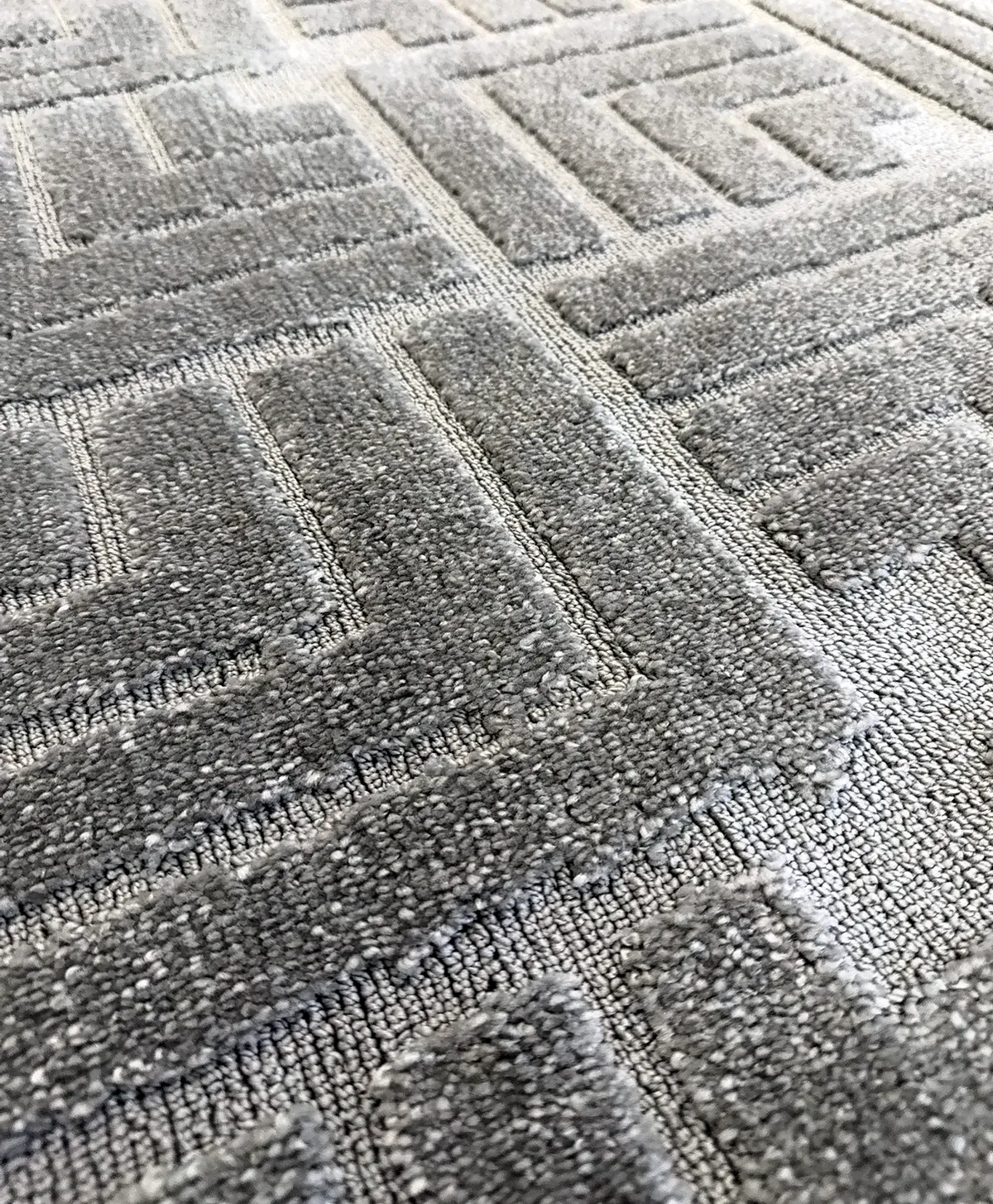 Bohemi cut and loop carpet with a geometric pattern