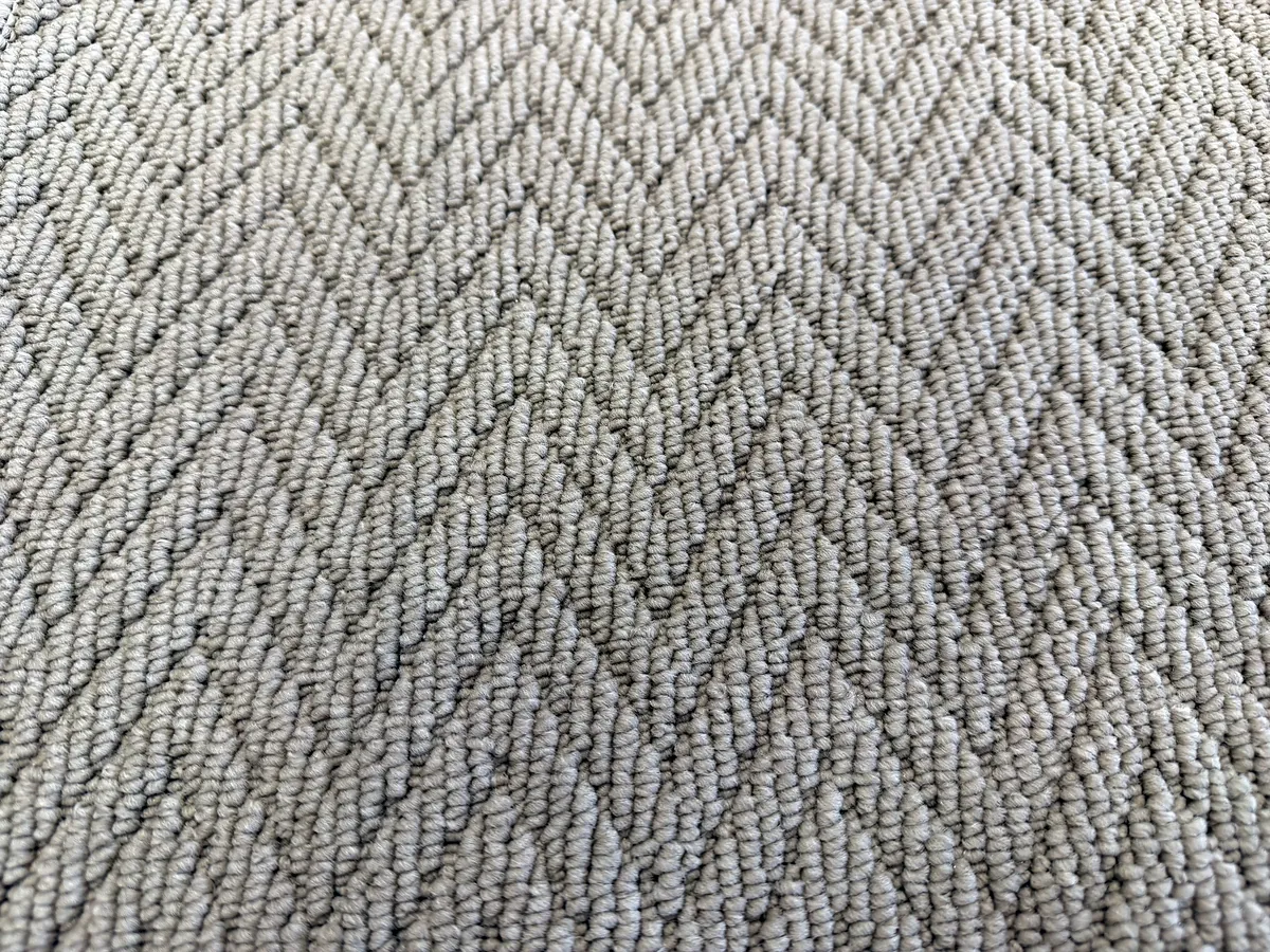 Assos loop pile carpet with a herringbone texture
