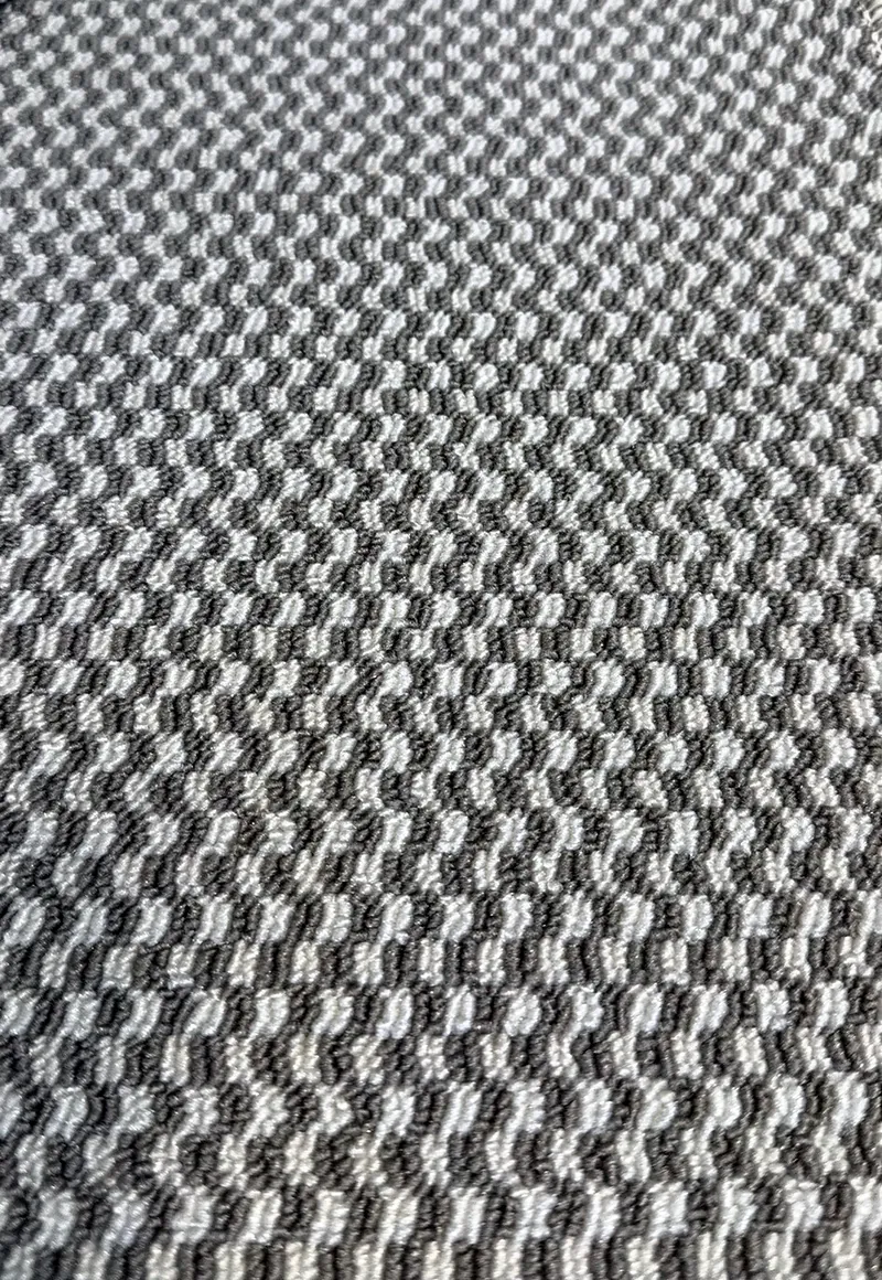 Ibiza scroll loop carpet with a small chevron pattern
