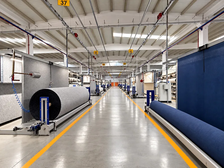 Tufted rolls coming off the line in the tufting corridor
